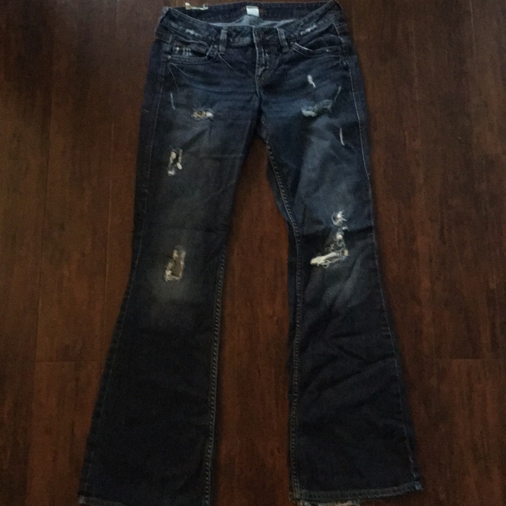 Distressed silver jeans